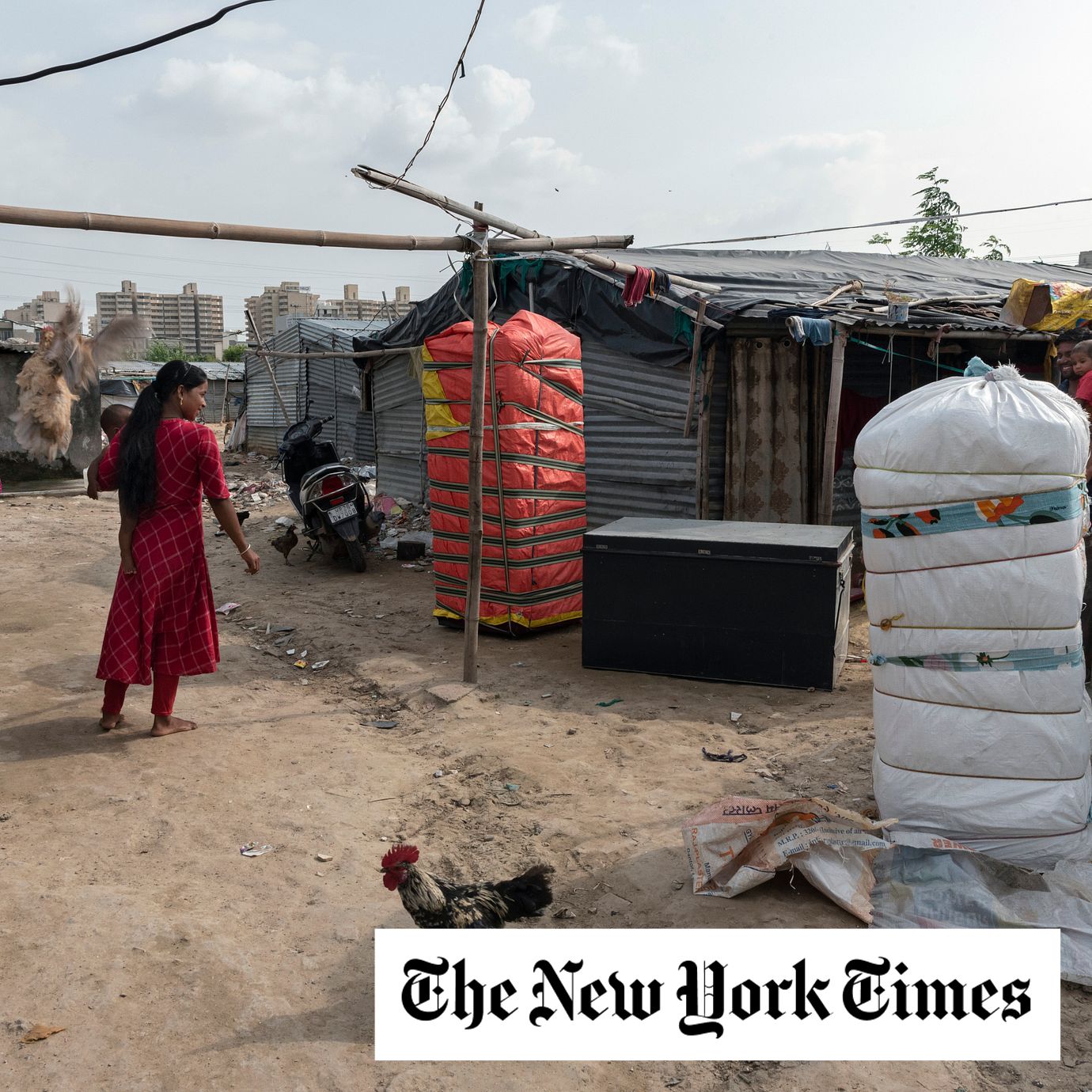 Residents pack their belongings on Aug. 7, 2023, after clashes in the state of Haryana, India, in the shadow of the burgeoning tech hub of Gurugram.