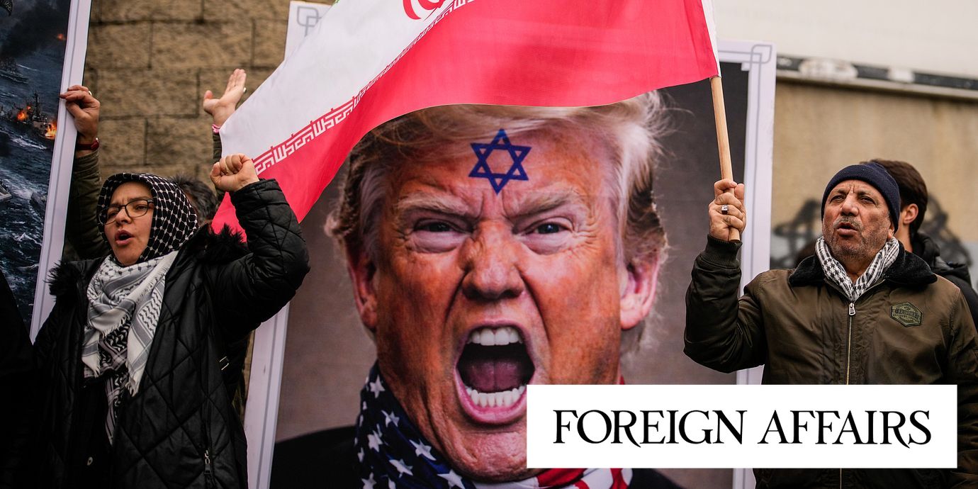 People shout slogans next to a poster of President Donald Trump, outside the U.S. Consulate in Istanbul, Turkey, Sunday, Feb. 1, 2026, during an anti-U.S. and anti-Israeli rally in support of the Iranian government.