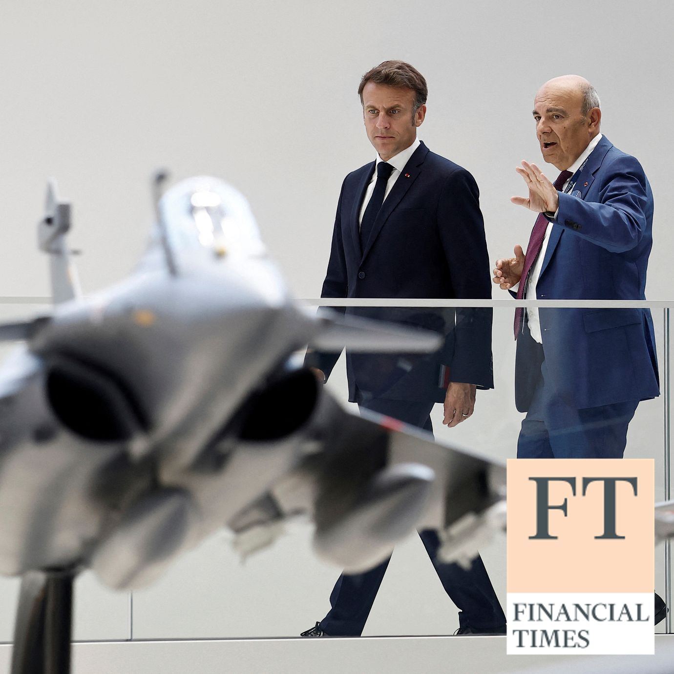 French President Emmanuel Macron looks at a display model of a Rafale fighter jet next to Eric Trappier, Chairman and Chief Executive Officer of Dassault Aviation. Nato countries need to find cheaper ways to compat the Russian drone threat.