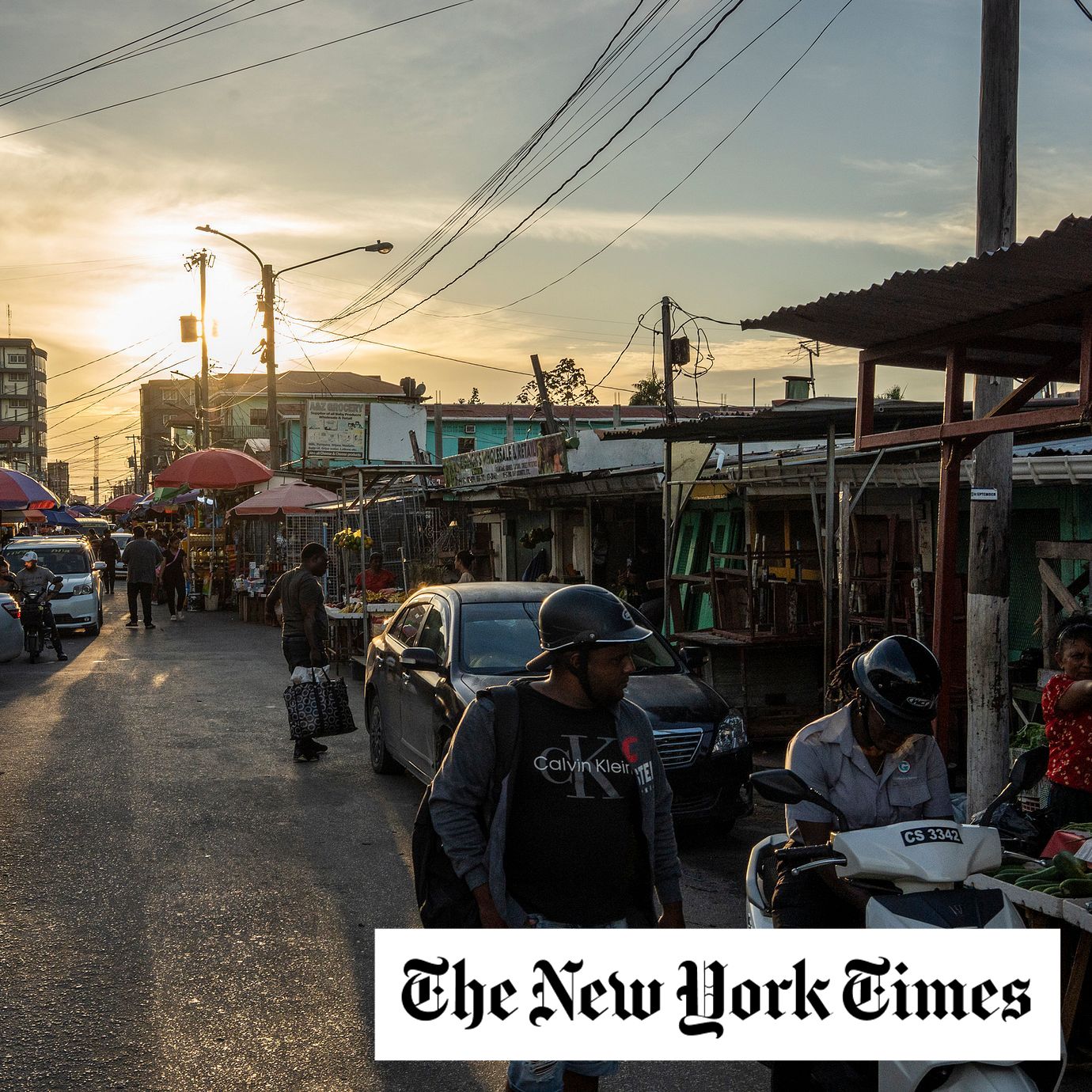 People walk along downtown Georgetown, Guyana. Oil-rich Guyana is enjoying red-hot growth but the boom is magnifying tensions over corruption, inequality and strained ties with Venezuela.