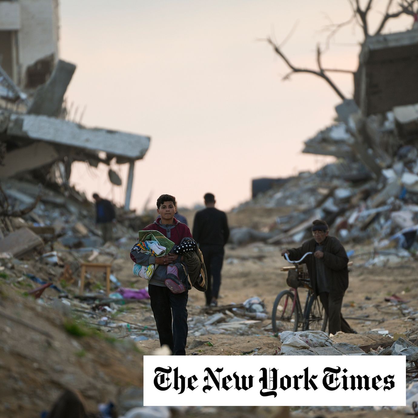 Palestinians walk along a street in Gaza City, littered with rubble from buildings destroyed during the Israeli army's ground and air offensive against Hamas in Gaza City, Tuesday Feb. 4, 2025.