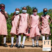 Pupils walk around the school compound during break time at Kitante Primary School in Kampala, Uganda Monday, Jan. 10, 2022.