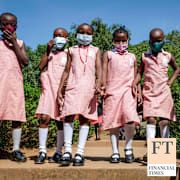 Pupils walk around the school compound during break time at Kitante Primary School in Kampala, Uganda Monday, Jan. 10, 2022.