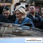 Marine Le Pen leaves the National Rally headquarters on Monday after her conviction on embezzlement charges.