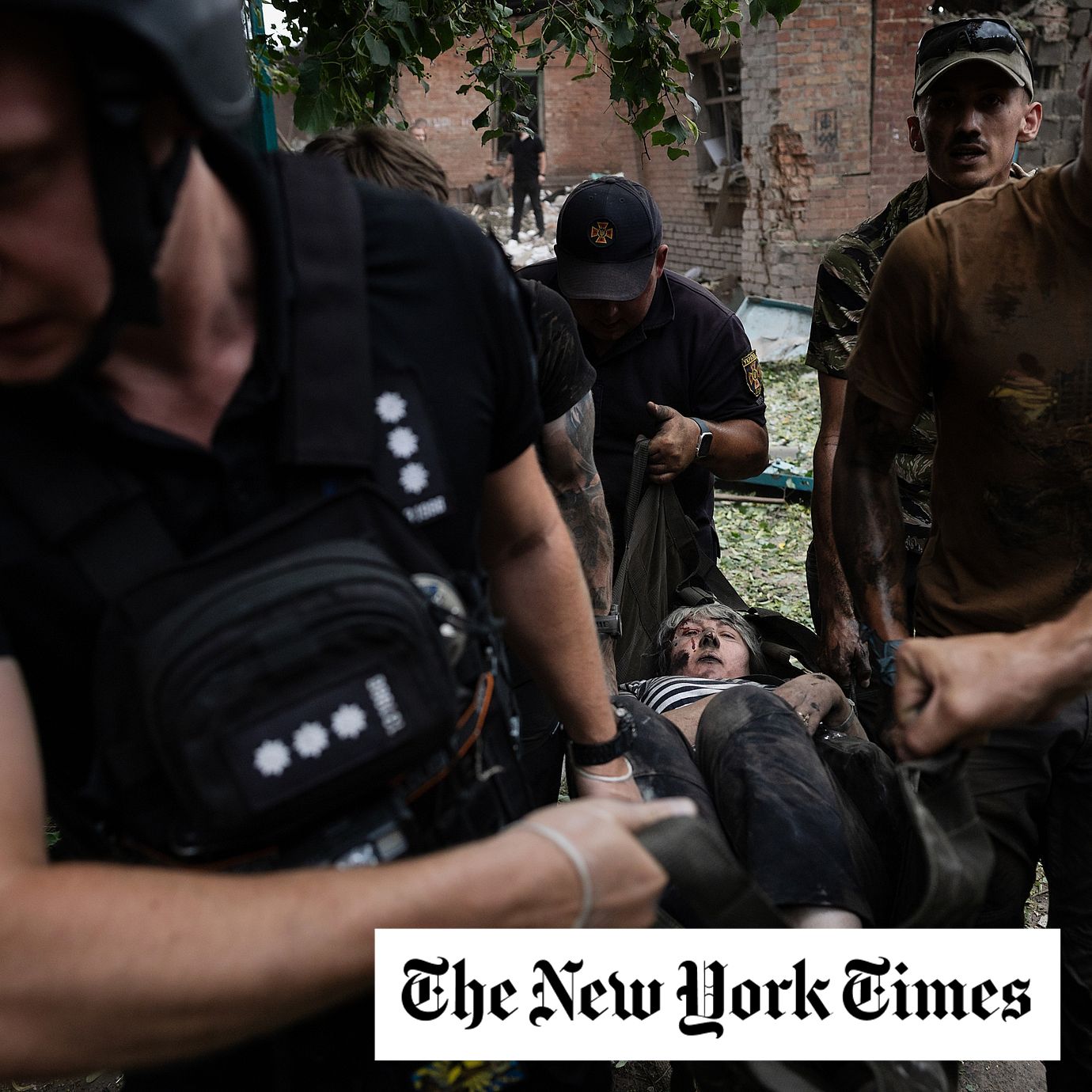 An injured woman is helped following a daytime strike carried out by Russian glide bombs in Sloviansk.
