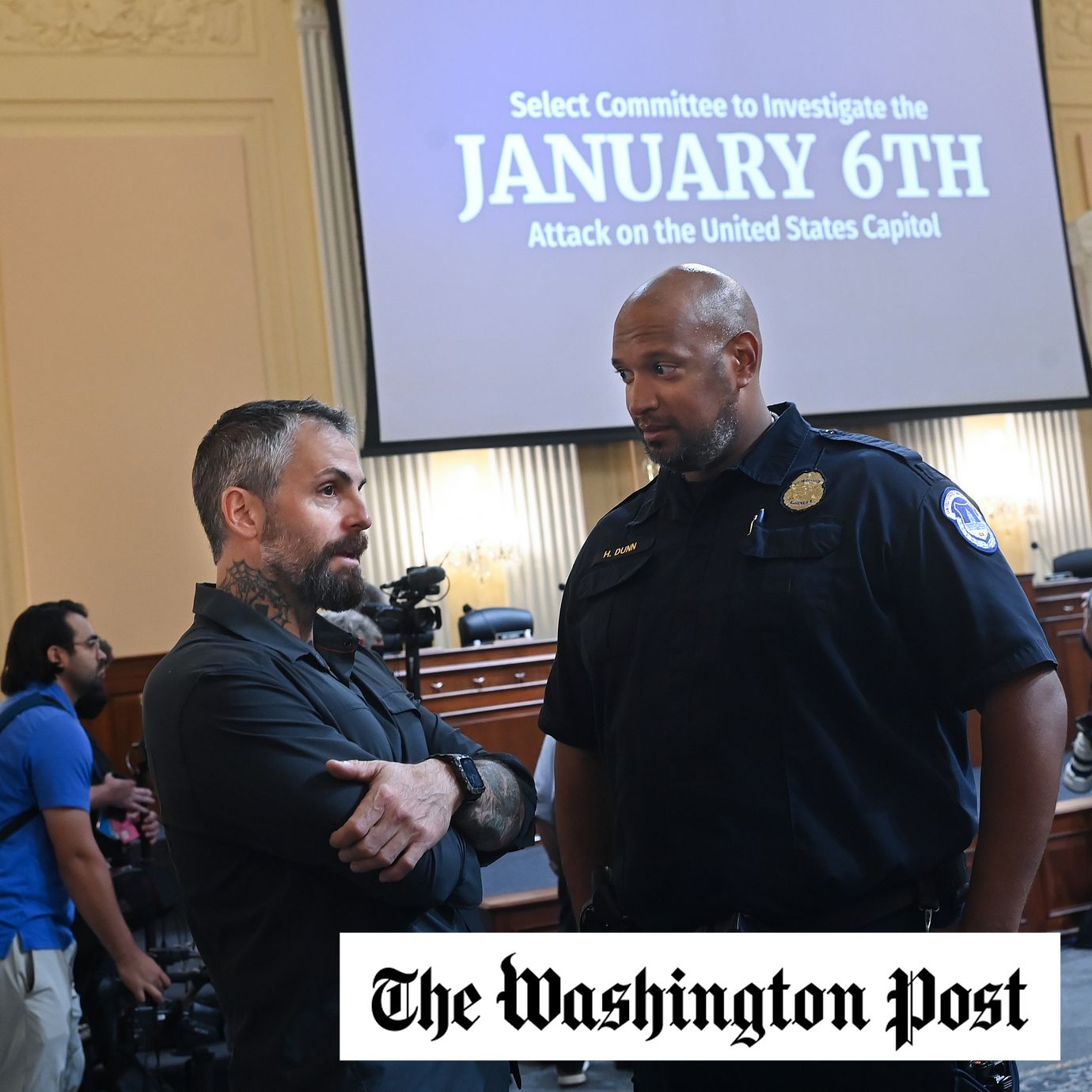 Former D.C. police officer Michael Fanone, left, and Capitol Police Officer Harry Dunn talk before a hearing of the House Select Committee on the Jan. 6 attack, in D.C. in 2022.
