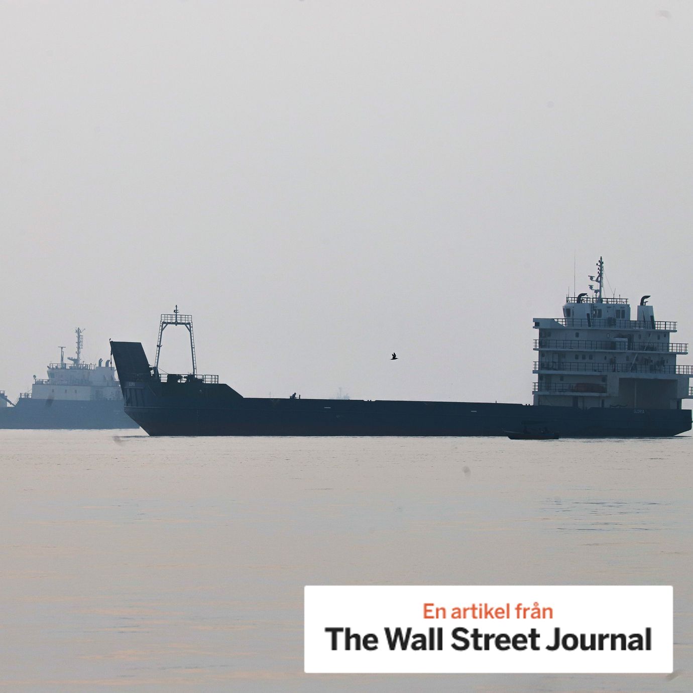 Commercial vessels appear anchored in the Strait of Hormuz off Bandar Abbas, Iran.