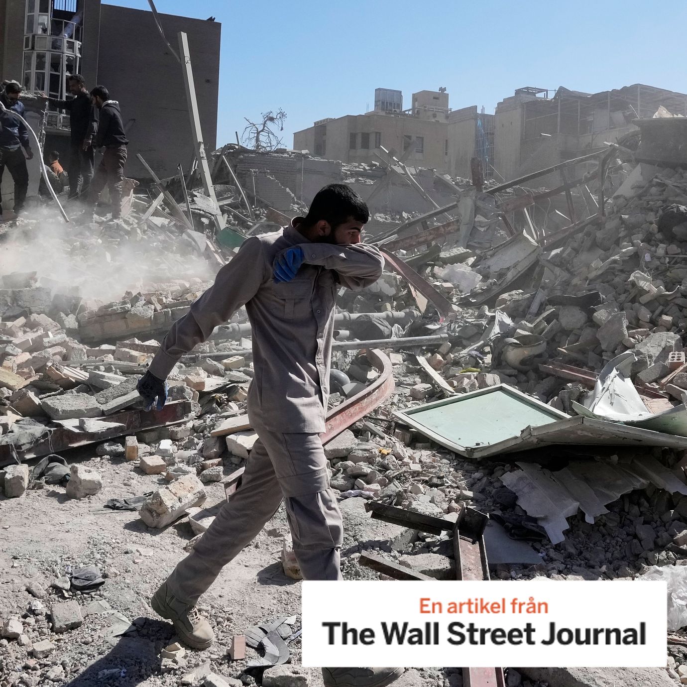 A group of men inspect the ruins of a police station struck Monday amid the U.S.–Israeli military campaign in Tehran.