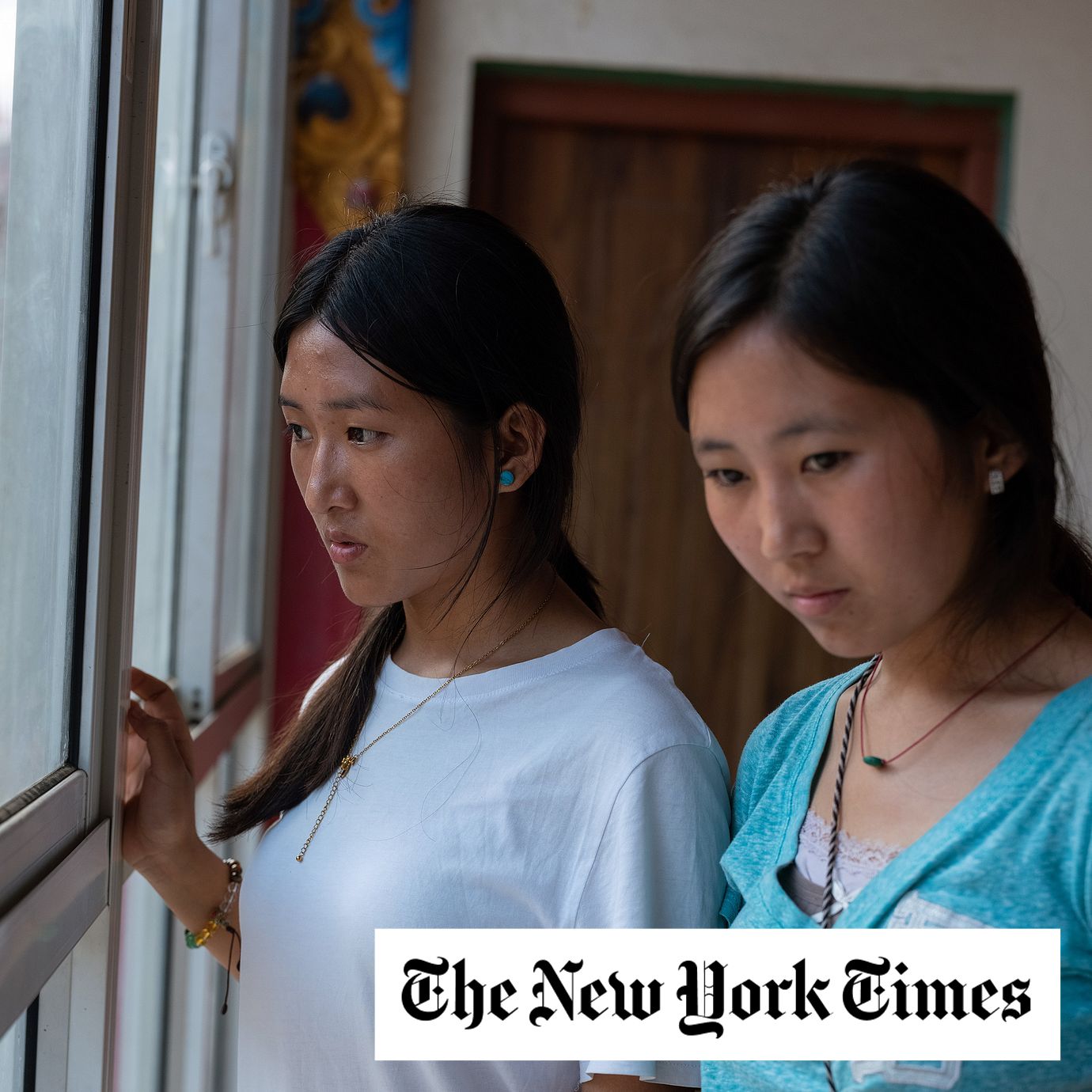 Soniya Ghale, left, and her sister at the Nubri Monastery holding center in Kathmandu, Nepal, on Sept. 12, 2026. Their father is among the more than 6,000 people still missing in Nepal after the floods.
