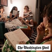 Michaela Davenport (from left), Miranda Lyman, Grace Anner and Madeline Sinovic listen to Eileen Tyrrell during a bookclub meeting about ”The Odyssey.”