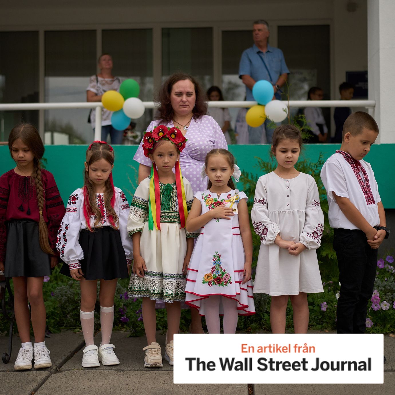 Children and teachers observe a daily nationwide minute of silence in memory of soldiers killed in the war with Russia during the traditional back to school celebrations in Kyiv. 1 september 2026.