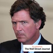 Tucker Carlson attends a meeting with President Donald Trump in January.