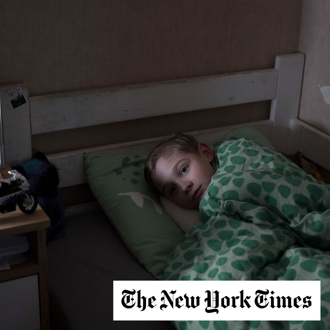 Mark Horskyi, 10, in bed at home after a day of repeated air raid sirens and bombardment in Kyiv.