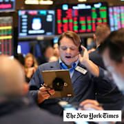 Traders work on the floor at the New York Stock Exchange in New York, Monday, Feb. 3, 2025.