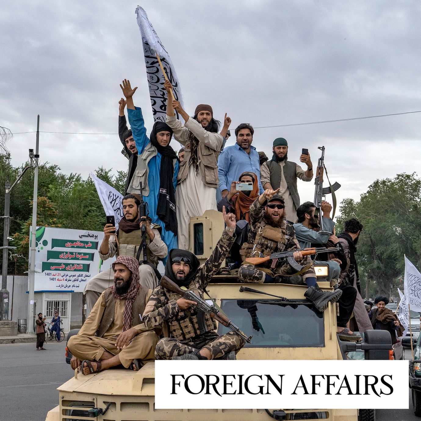 Taliban fighters celebrate one year since they seized the Afghan capital, Kabul, in front of the U.S. Embassy in Kabul, Afghanistan, Monday, Aug. 15, 2022.