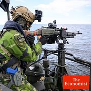 A sniper aboard a CB90 HSM fast assault craft practices engaging surface targets during the Aurora 26 exercise at the Väddö firing range.