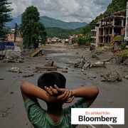 A boy looks at the devastation caused by flash flooding along the Trishuli River in Nepal’s Nuwakot district.