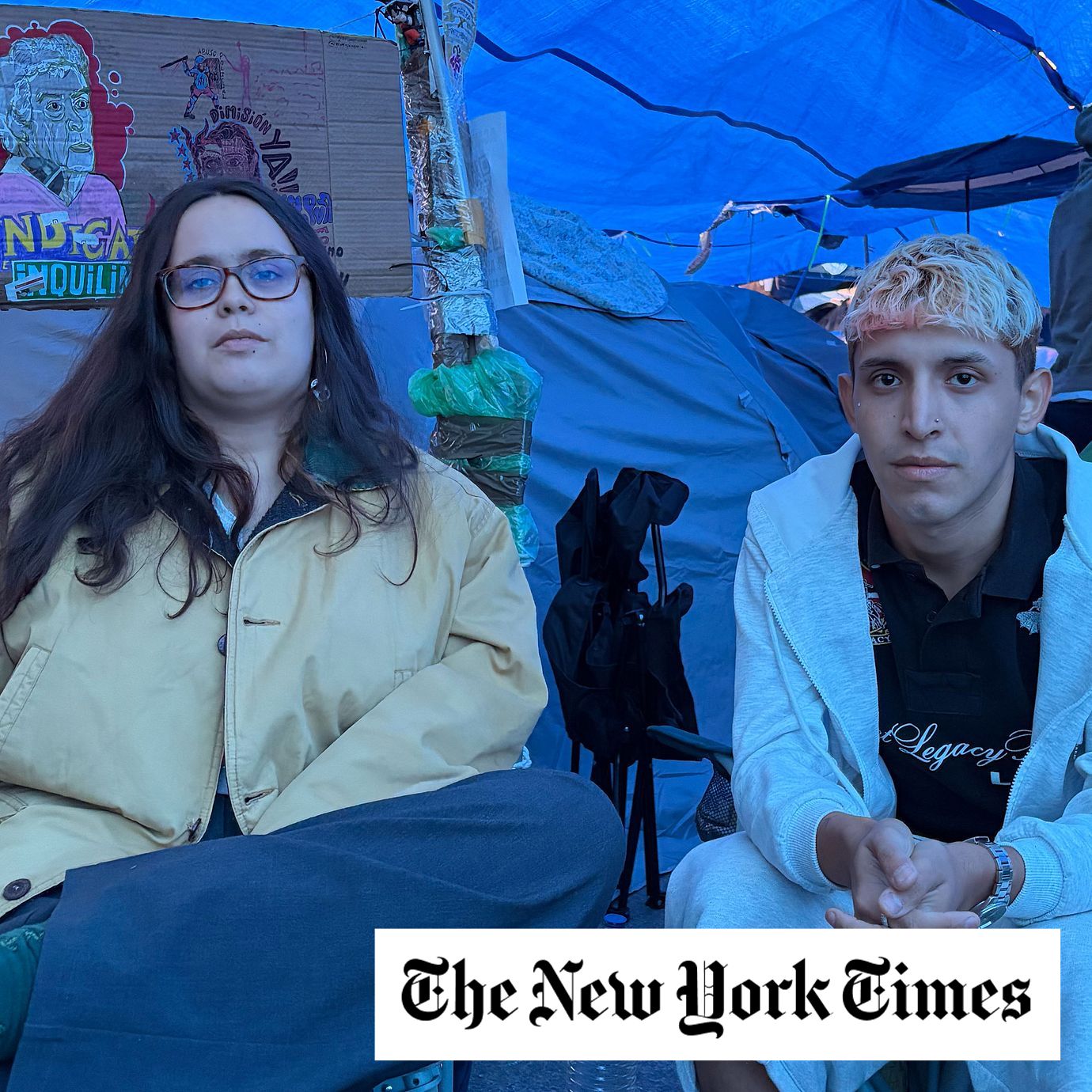 Alejandra Osés, a graduate student who shares an apartment that rents for $1,680 a month, and Santiago Larraín, a Chilean immigrant who shares an apartment with his mother that rents for $1,345 a month, at a protest over soaring rents in Madrid.