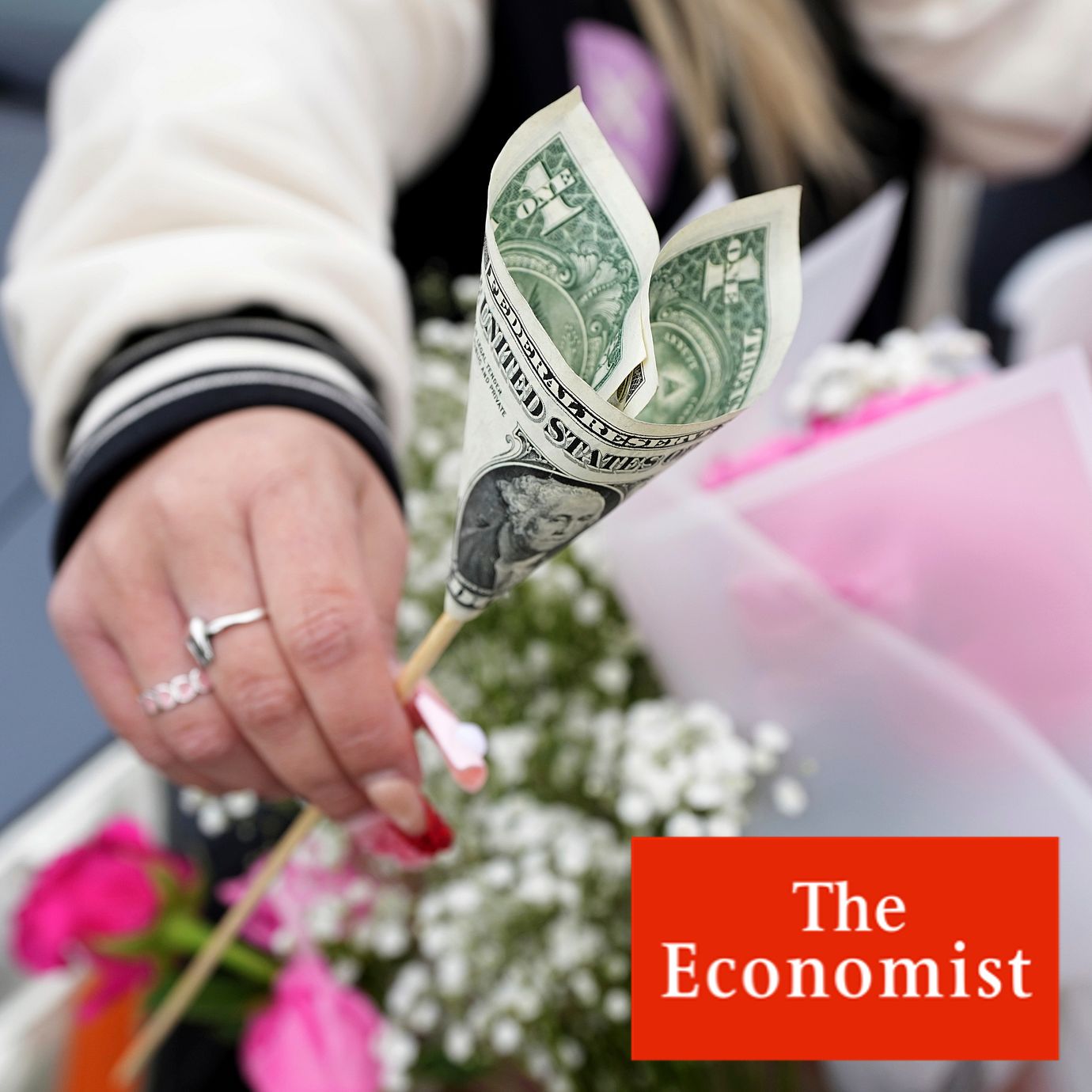 A heart-shaped dollar bill in a floral arrangement at a Valentine's Day street-side stand in Richardson, Texas, Feb. 14, 2025.