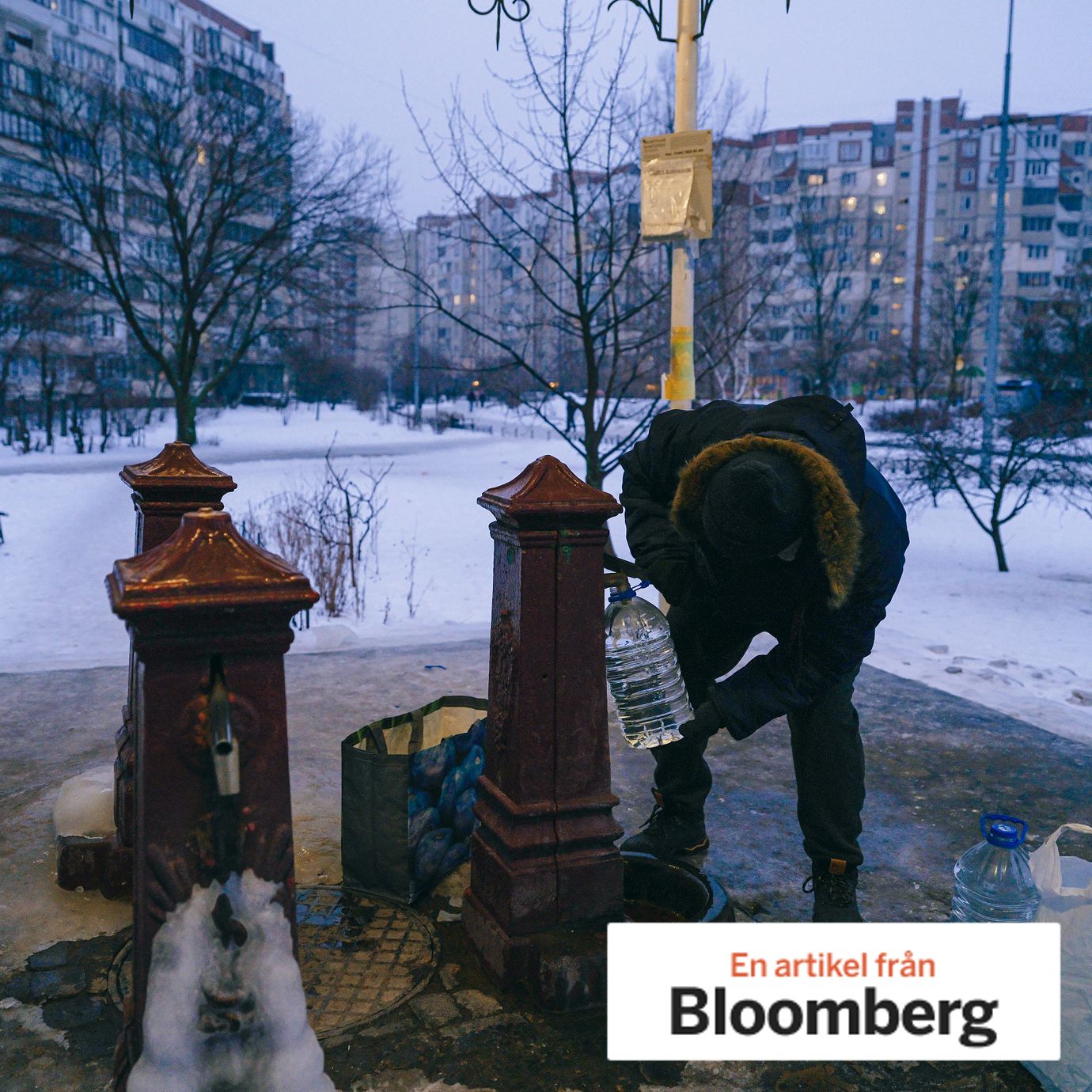 A resident collects water in the Troeshchyna neighborhood of Kyiv, in January.