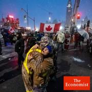 Protesters dance and embrace as a song plays over the speakers, during an ongoing protest against COVID-19 measures that has grown into a broader anti-government protest, in Ottawa, Ontario, on Thursday, Feb. 17, 2022.